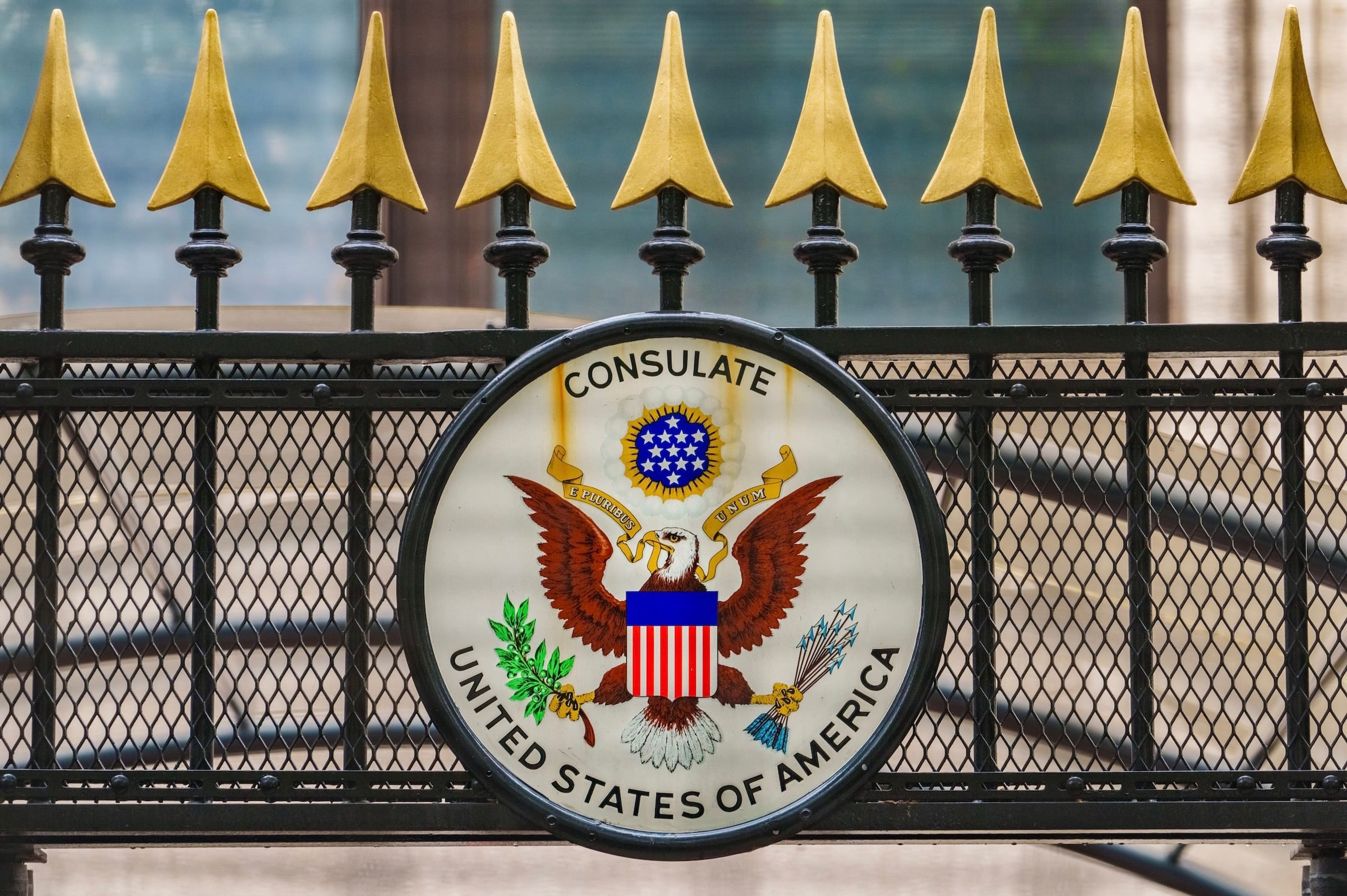 U.S. consulate sign on a fence, as third-country visa appointments end for nonimmigrant applicants