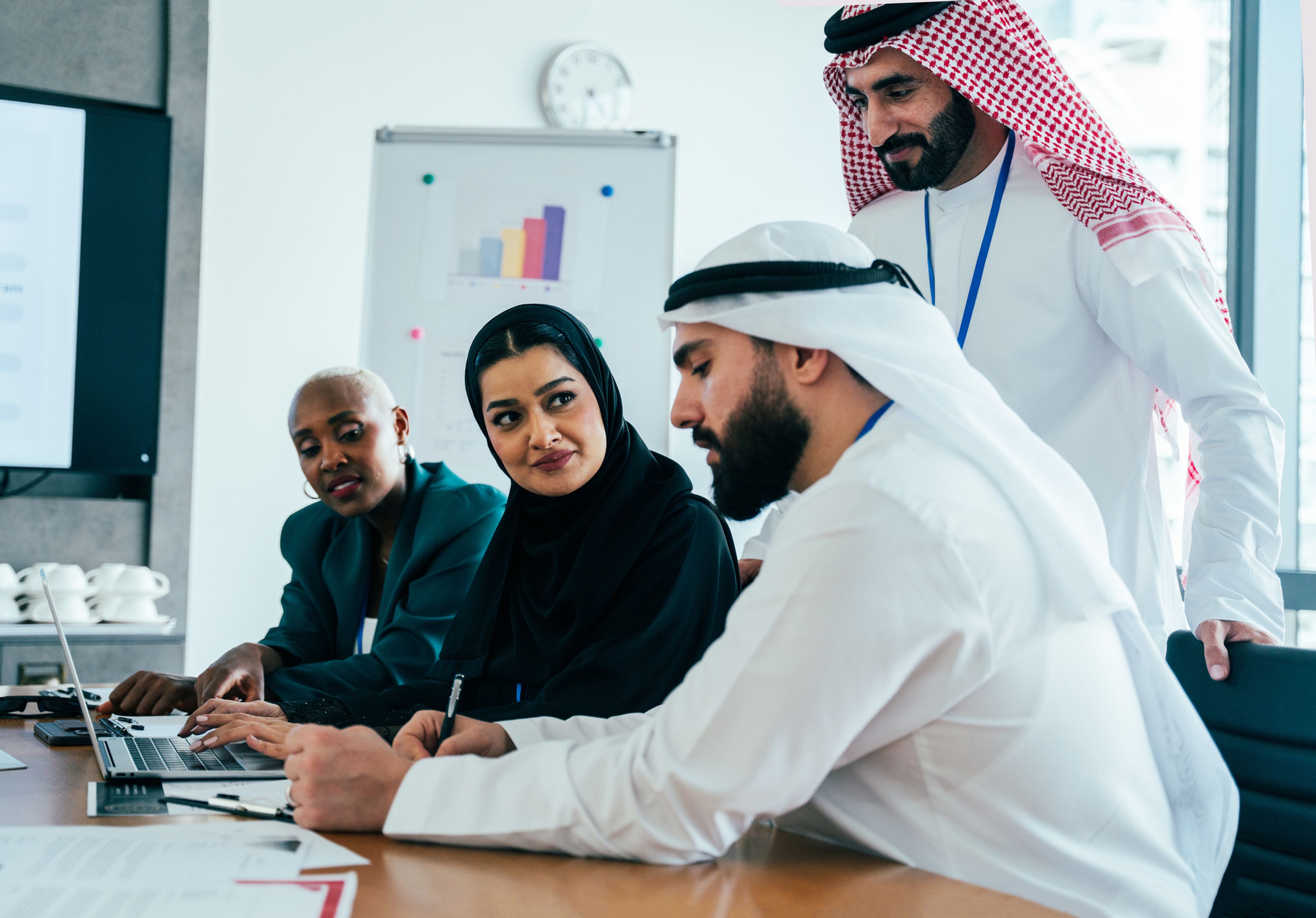 Multiethnic business team collaborating during a corporate meeting in an office.