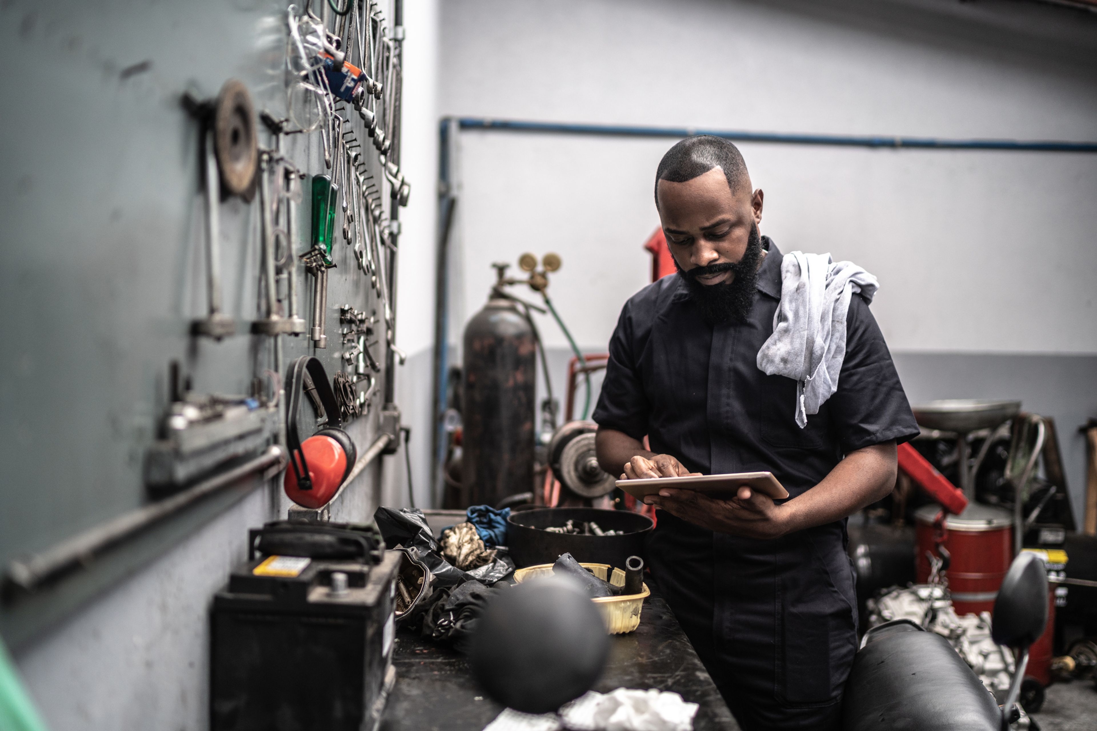 Man working with tablet in auto repair