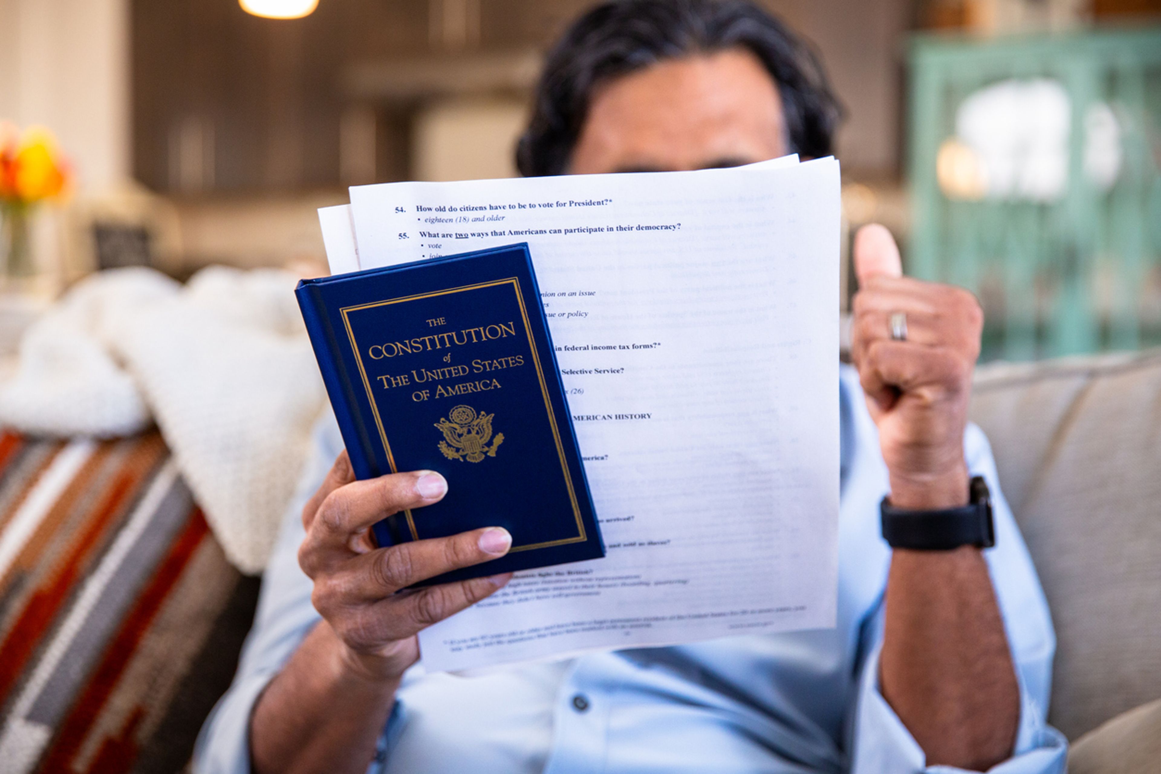 Person studying for the U.S. naturalization test.
