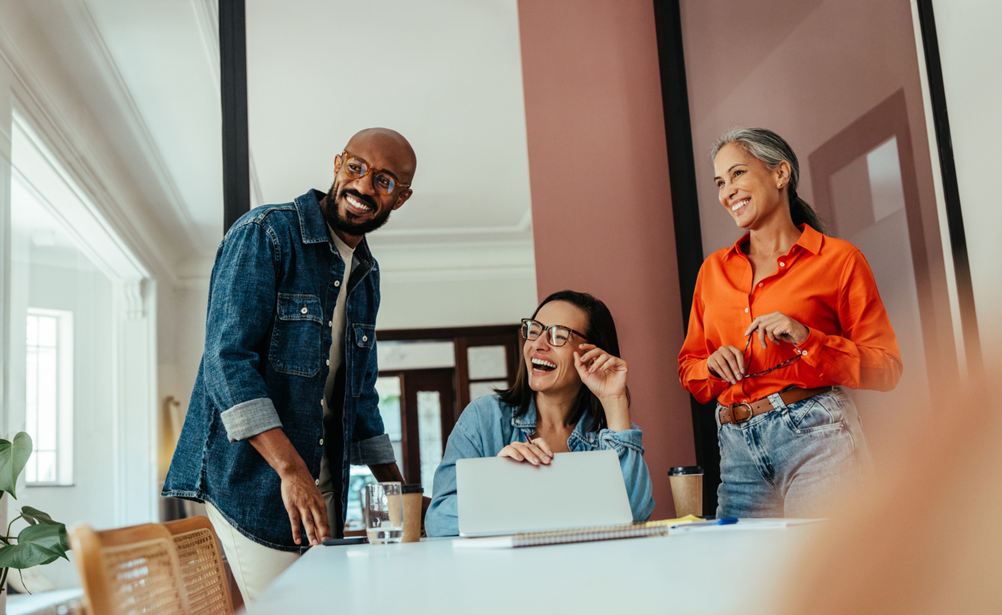 people in an office smiling
