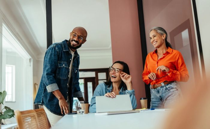 people in an office smiling