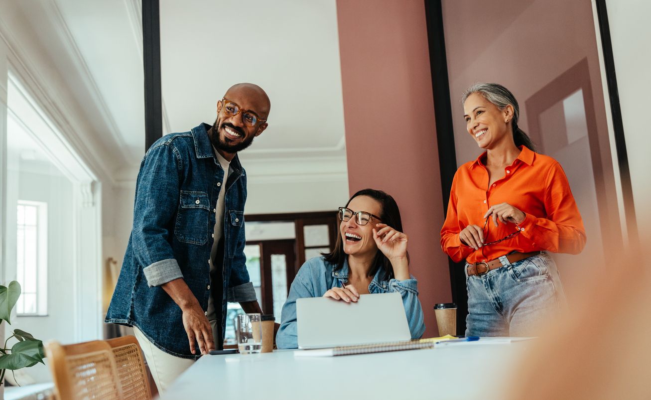 people in an office smiling