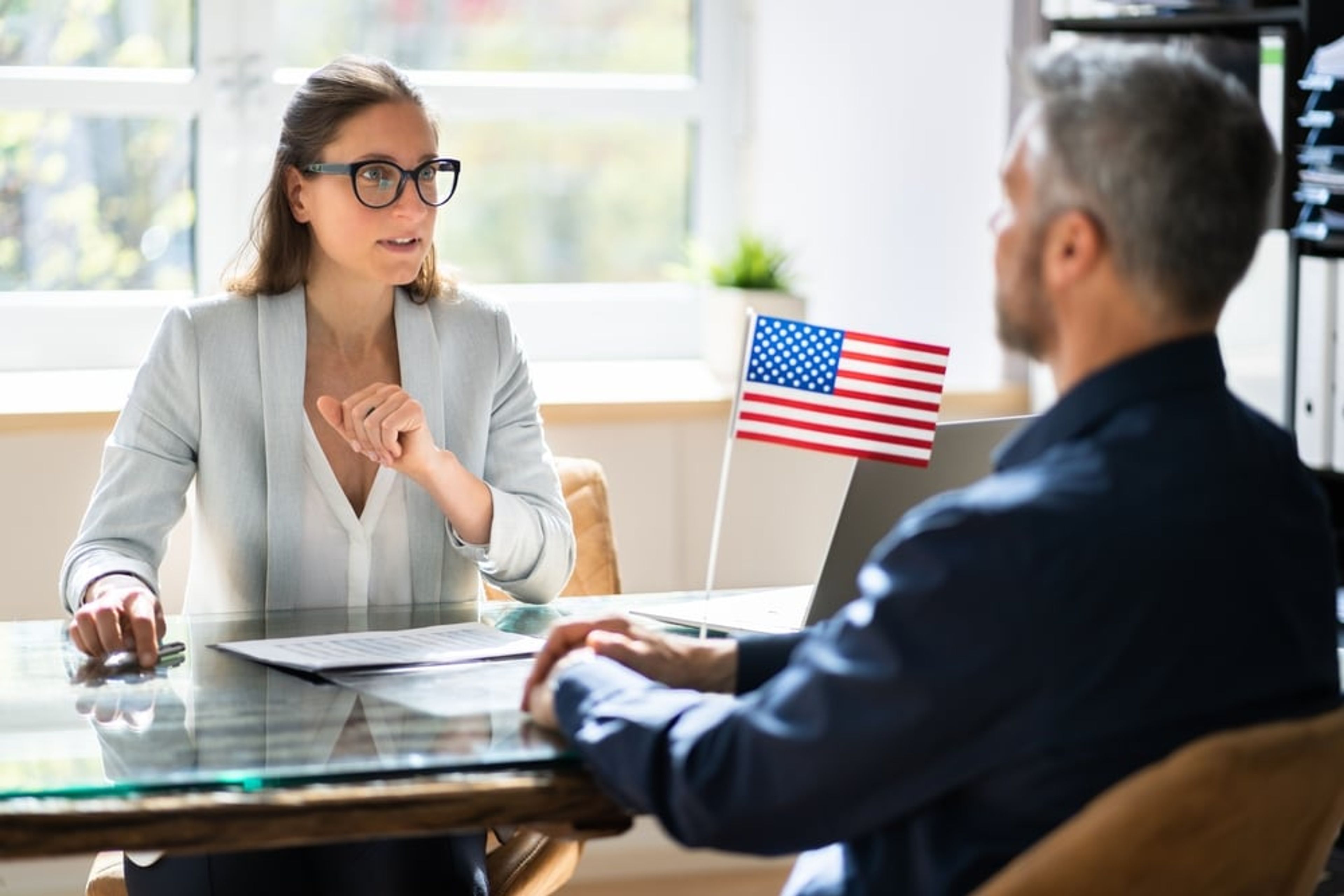 Consular officer reviewing a visa applicant's medical information at a U.S. embassy