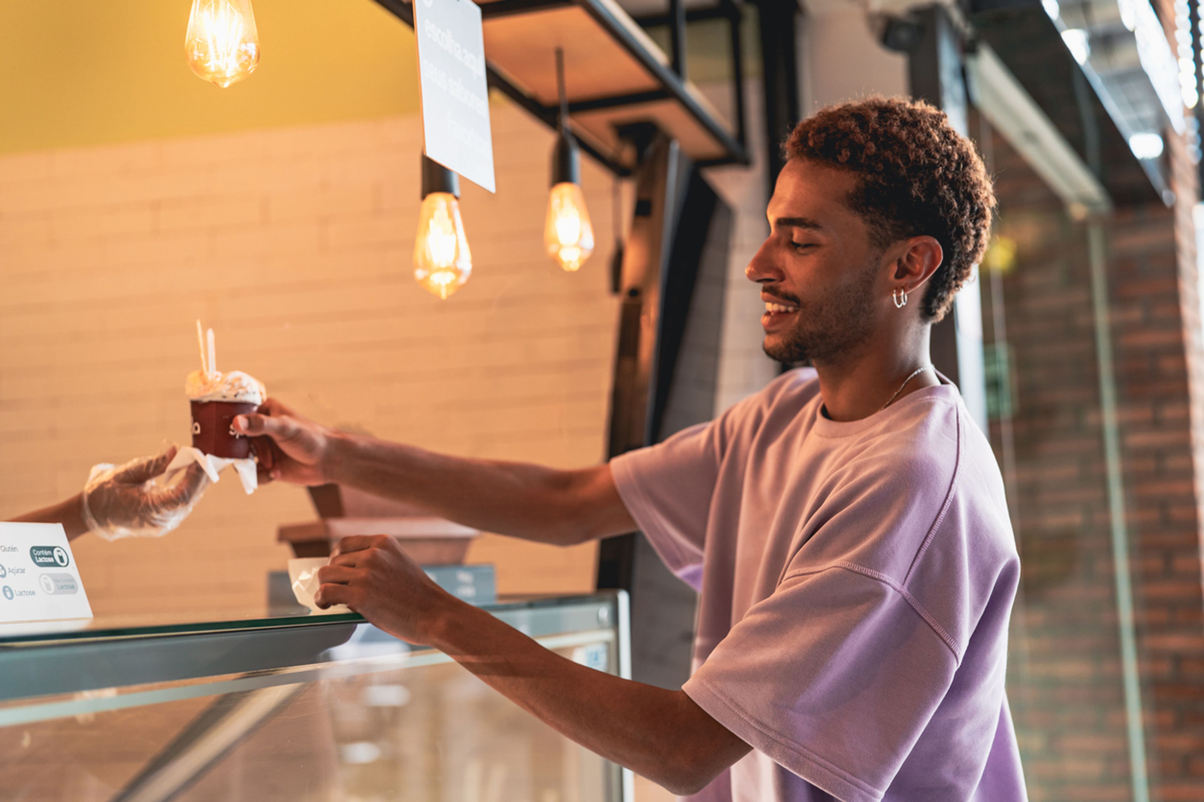 Small business owner in her storefront, one of five unique E-2 visa qualifying businesses