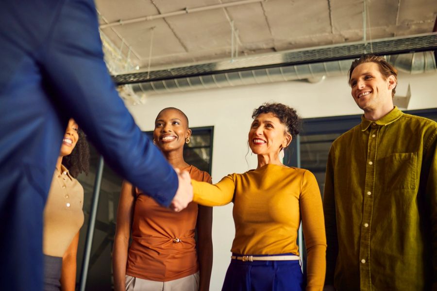 Business people, welcome and shaking hands in office for introduction, partnership and meeting for collaboration.