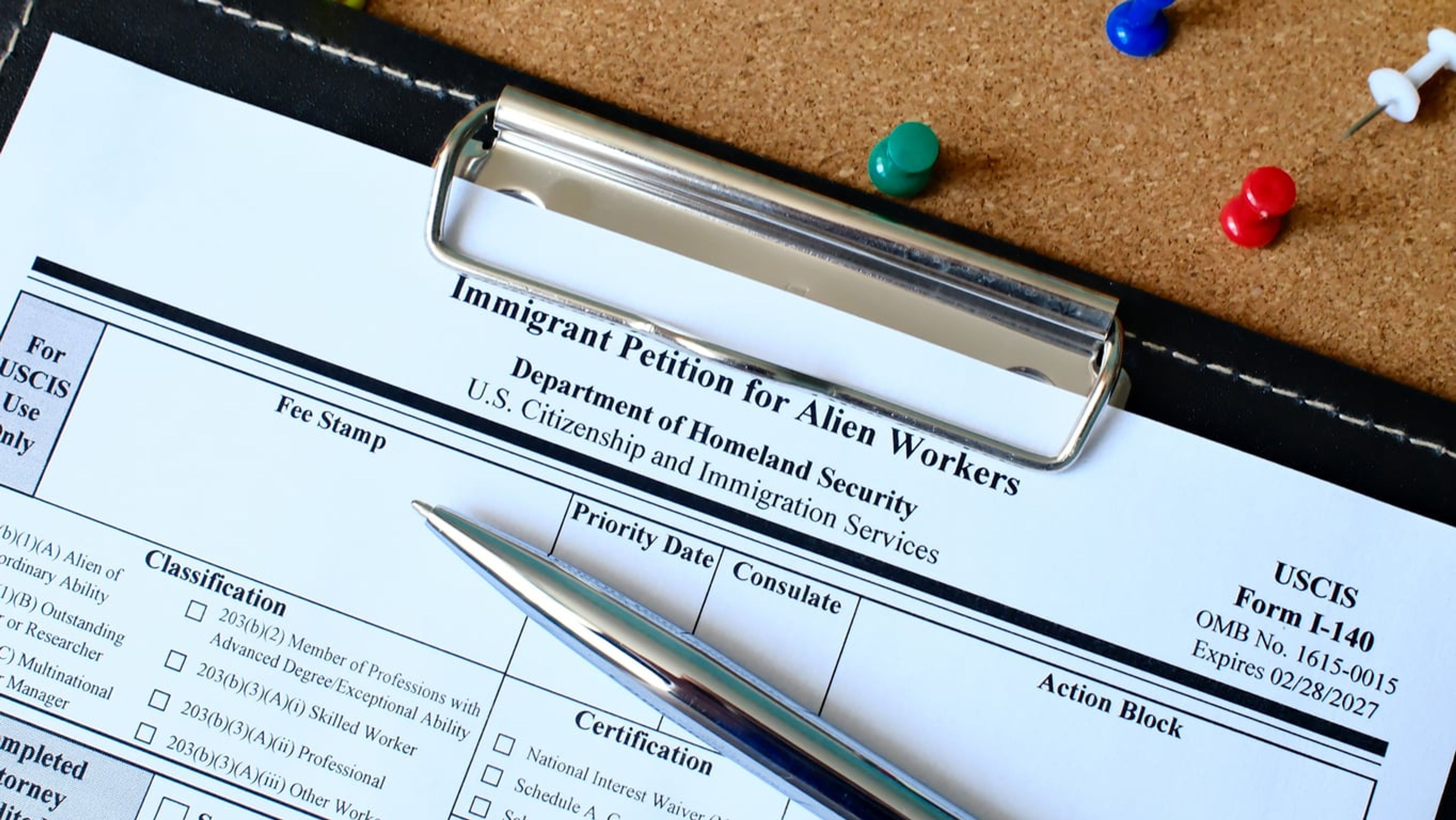 A closeup of USCIS Form I-140, Immigrant Petition for Alien Workers.