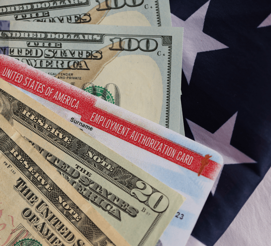 Employer calculating H-1B visa filing fees with a calculator and paperwork