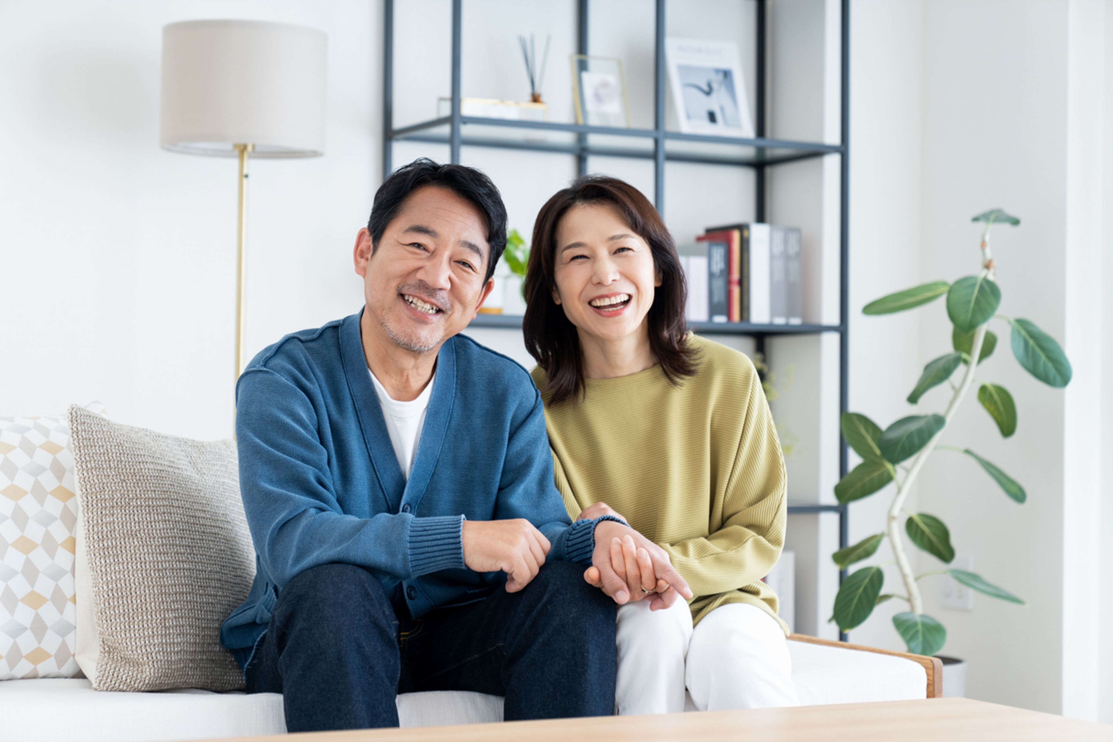 A couple relaxing in the living room of their home.