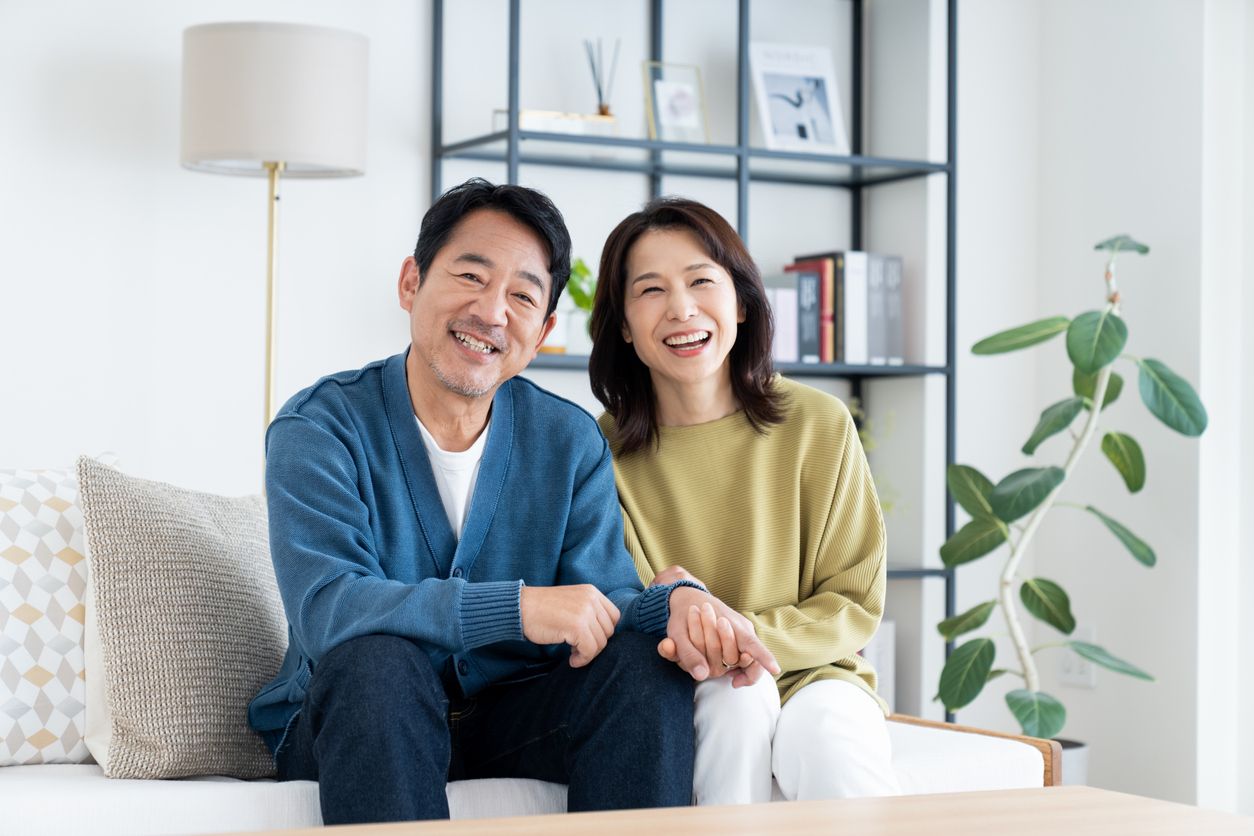 A couple relaxing in the living room of their home.
