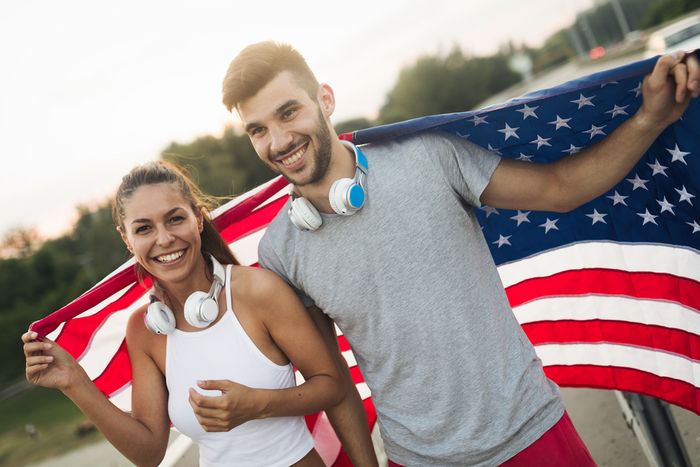 Adult siblings embracing after approval of a Form I-130 sibling petition