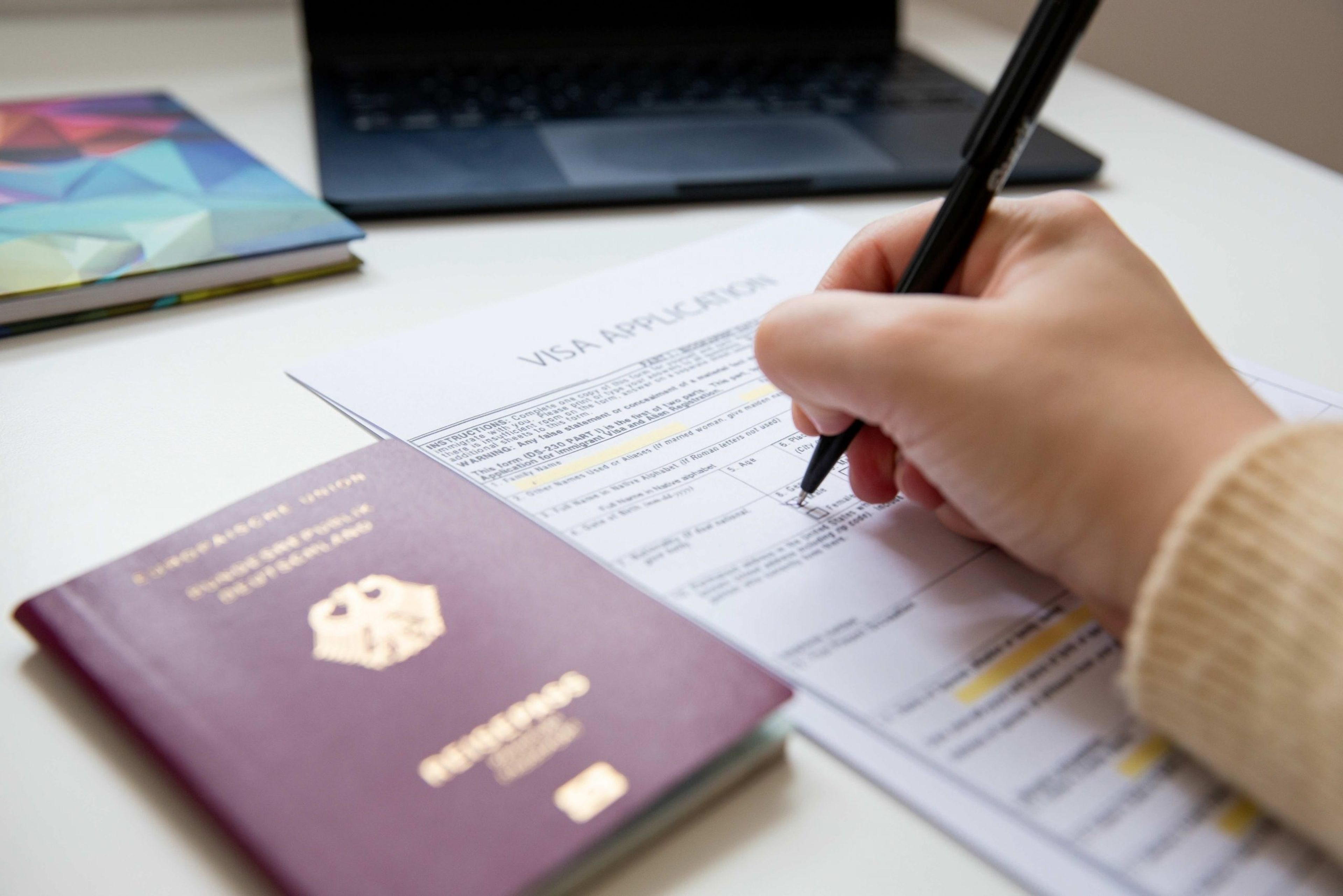 Traveler holding a passport affected by the B-1/B-2 tourist visa bond program