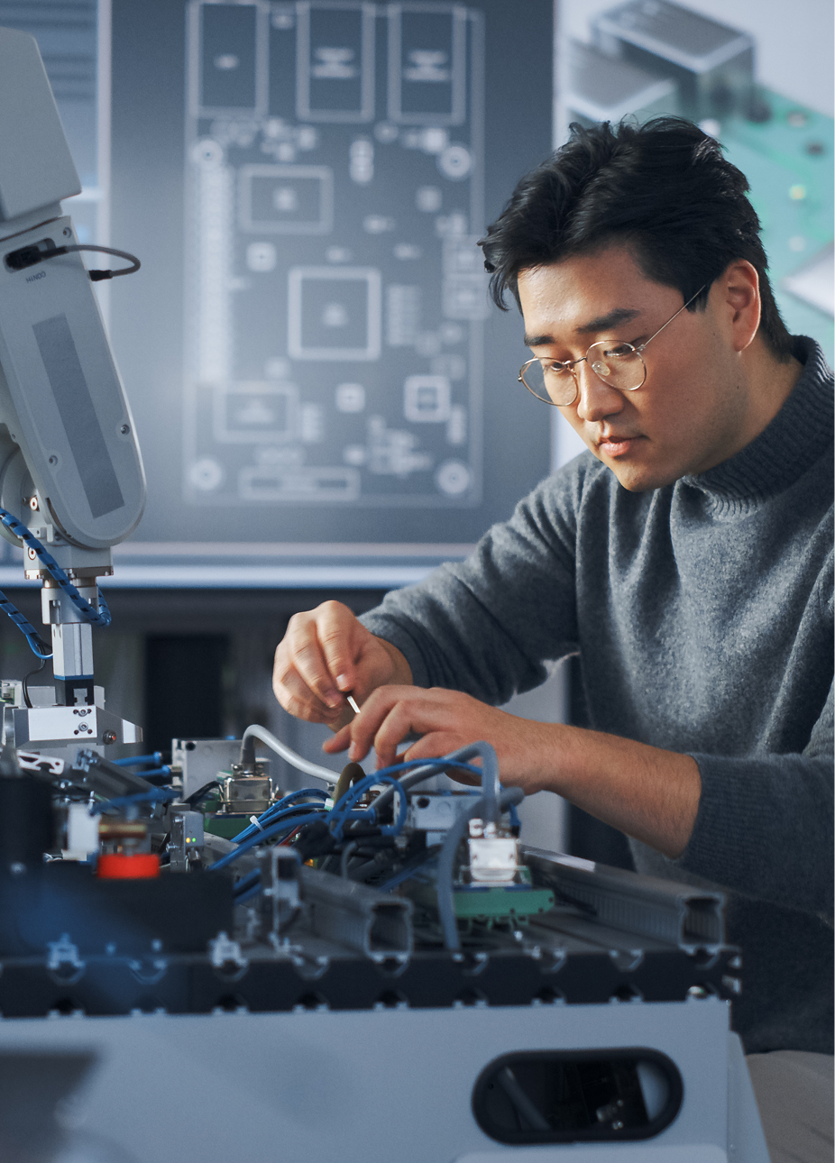 An engineer adjusting components in a high-tech lab