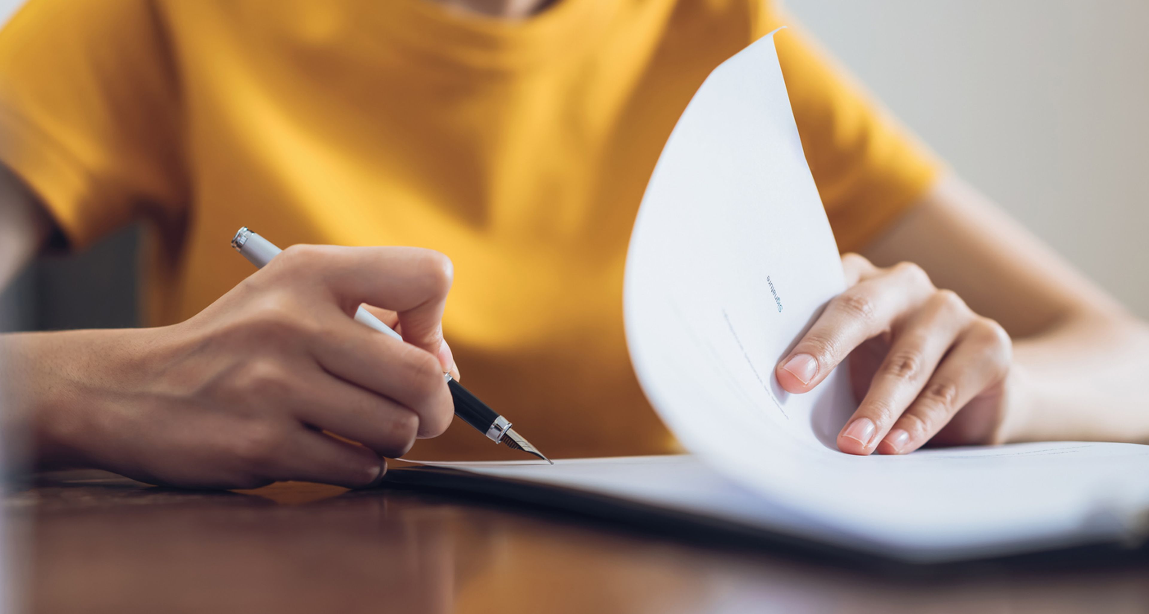 Woman filling out an asylum work permit application form