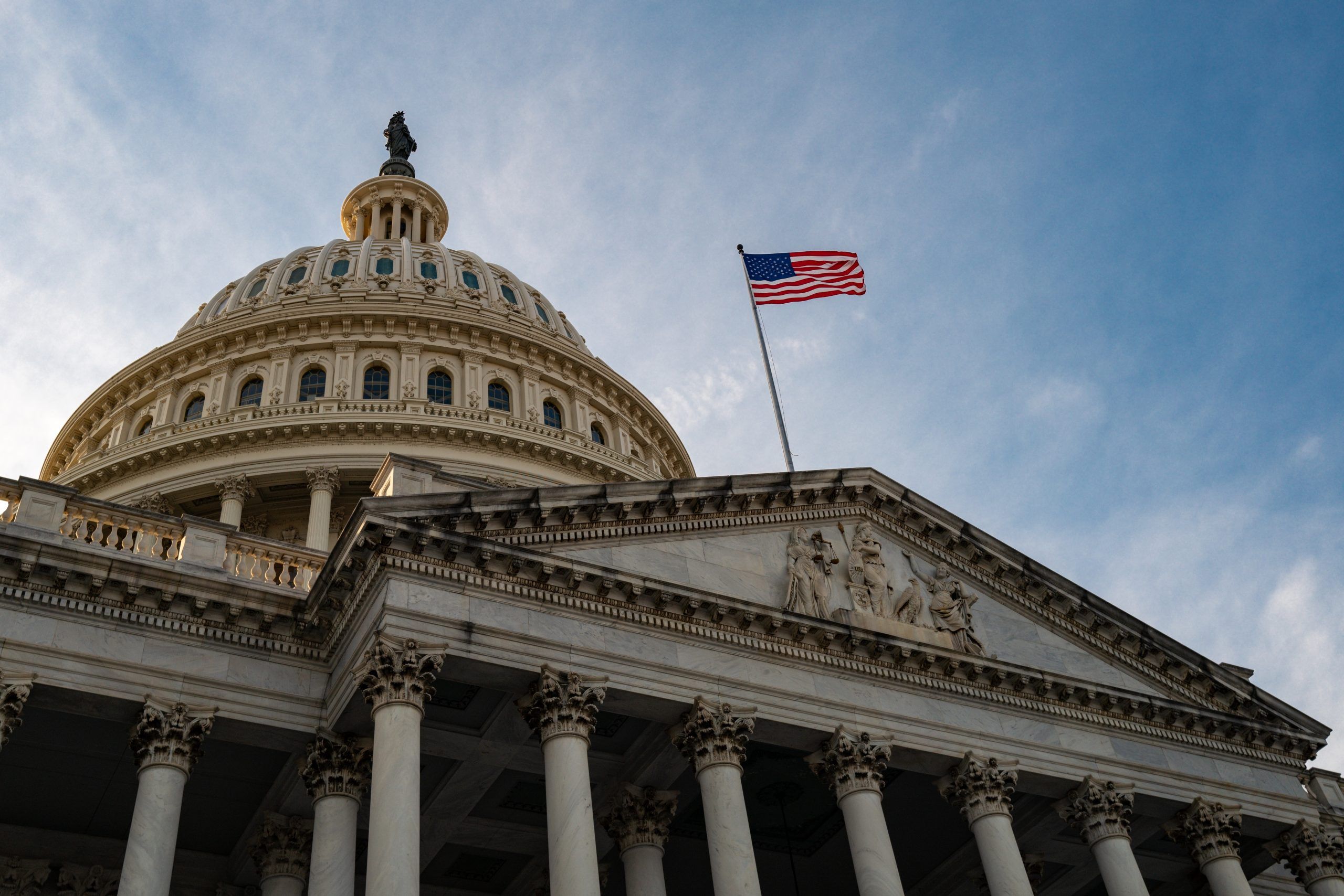 USCIS paperwork and American flag for the weekly immigration news roundup