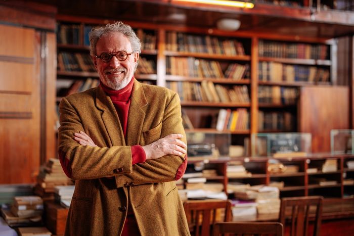 Portrait of a university professor standing in his office.