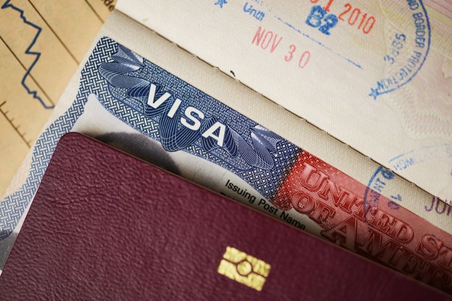 Closeup of US visa against a foreign passport.