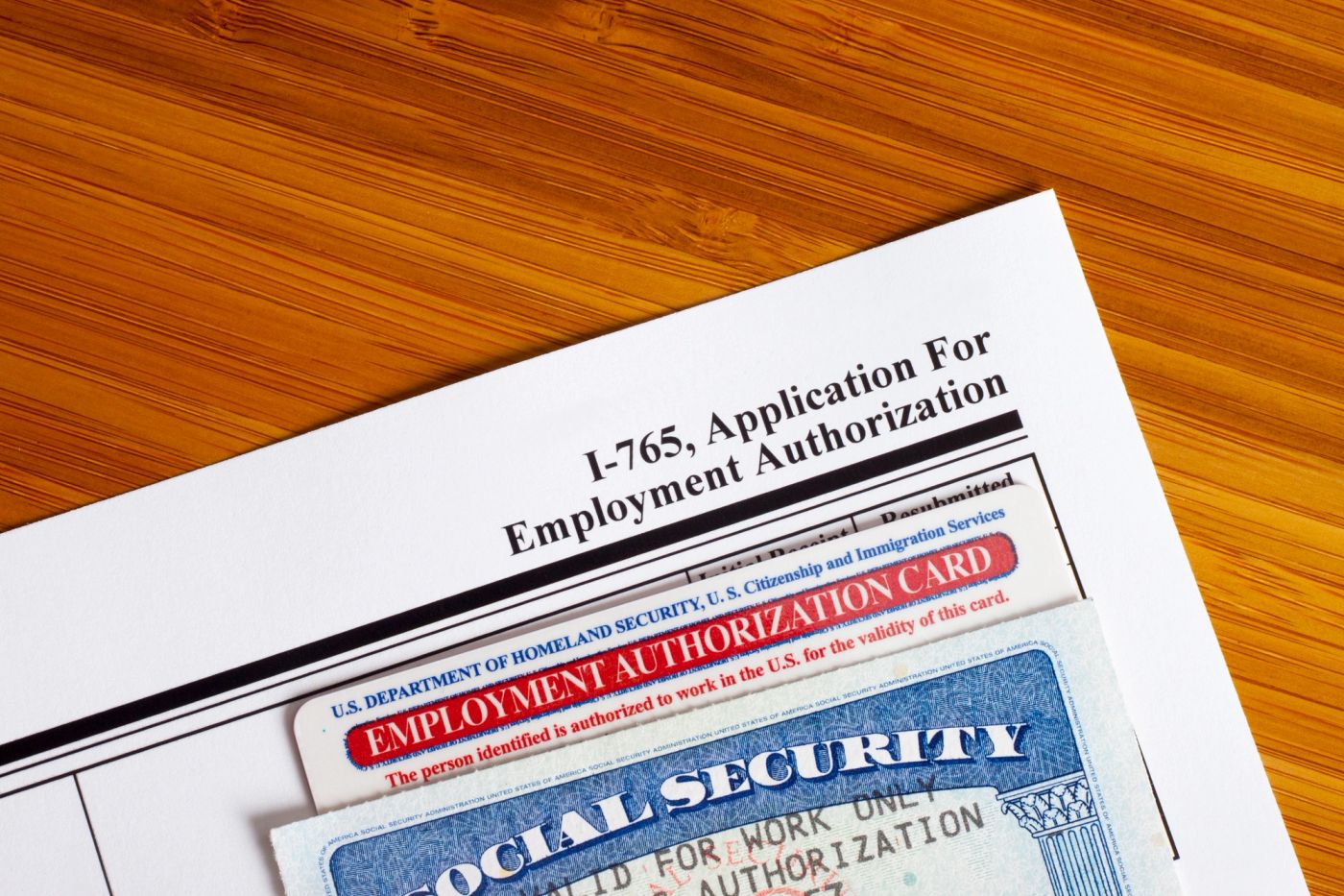 Form I-765 application for employment authorization on a desk, illustrating the new 09/15/26 edition USCIS will require starting September 15, 2026
