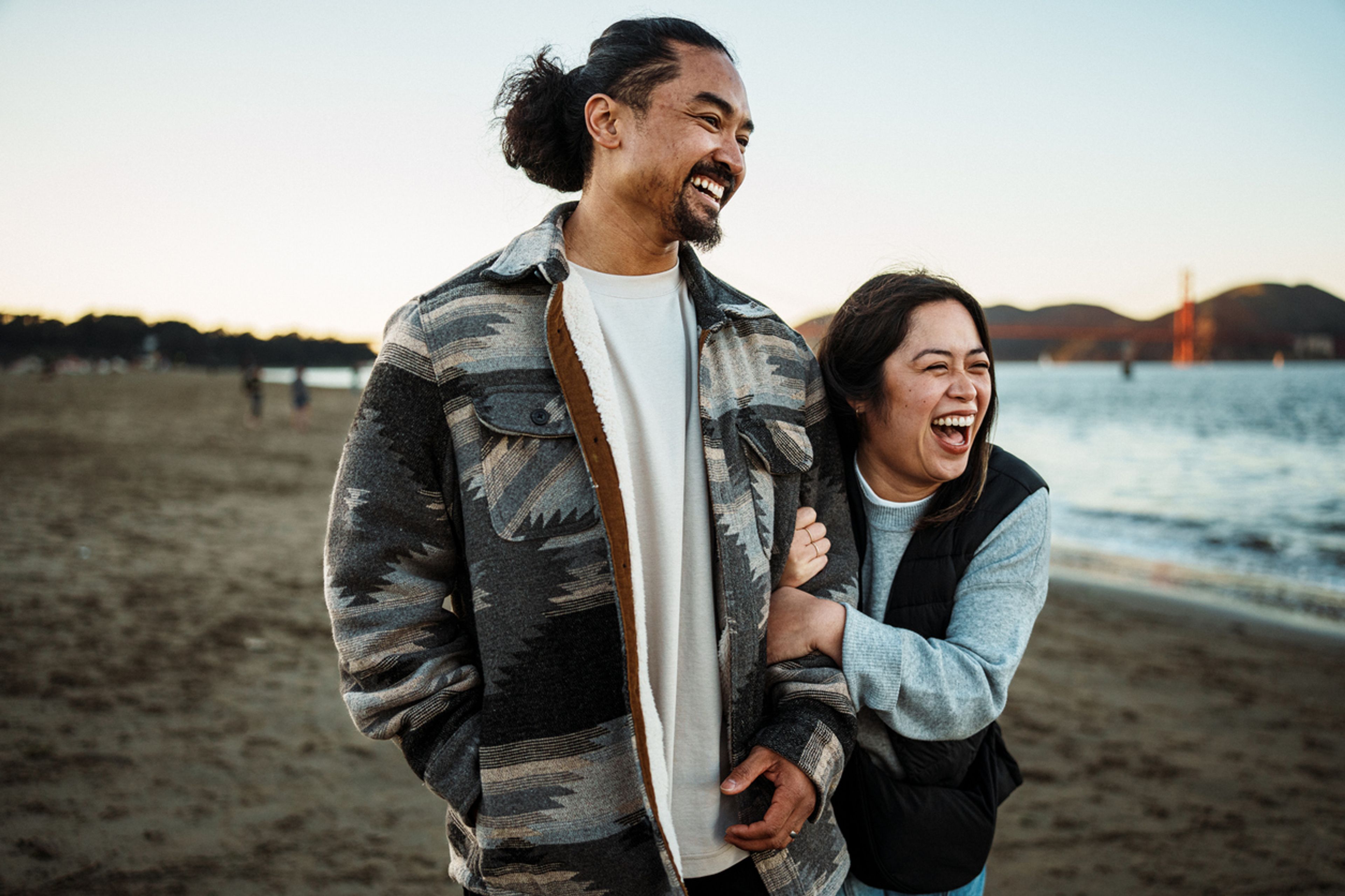 Happy Filipino couple together on the beach