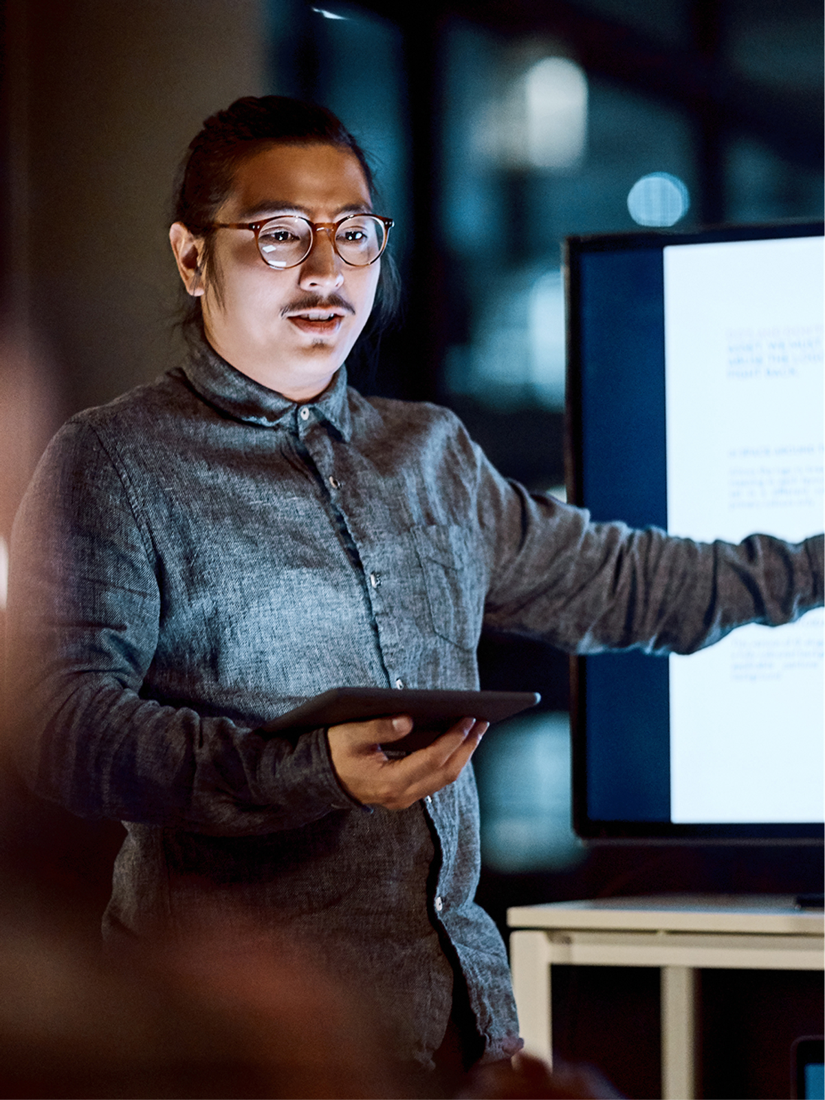 An engineer presenting technical work on a screen