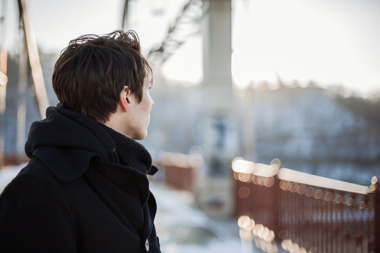 Young person seen from behind.