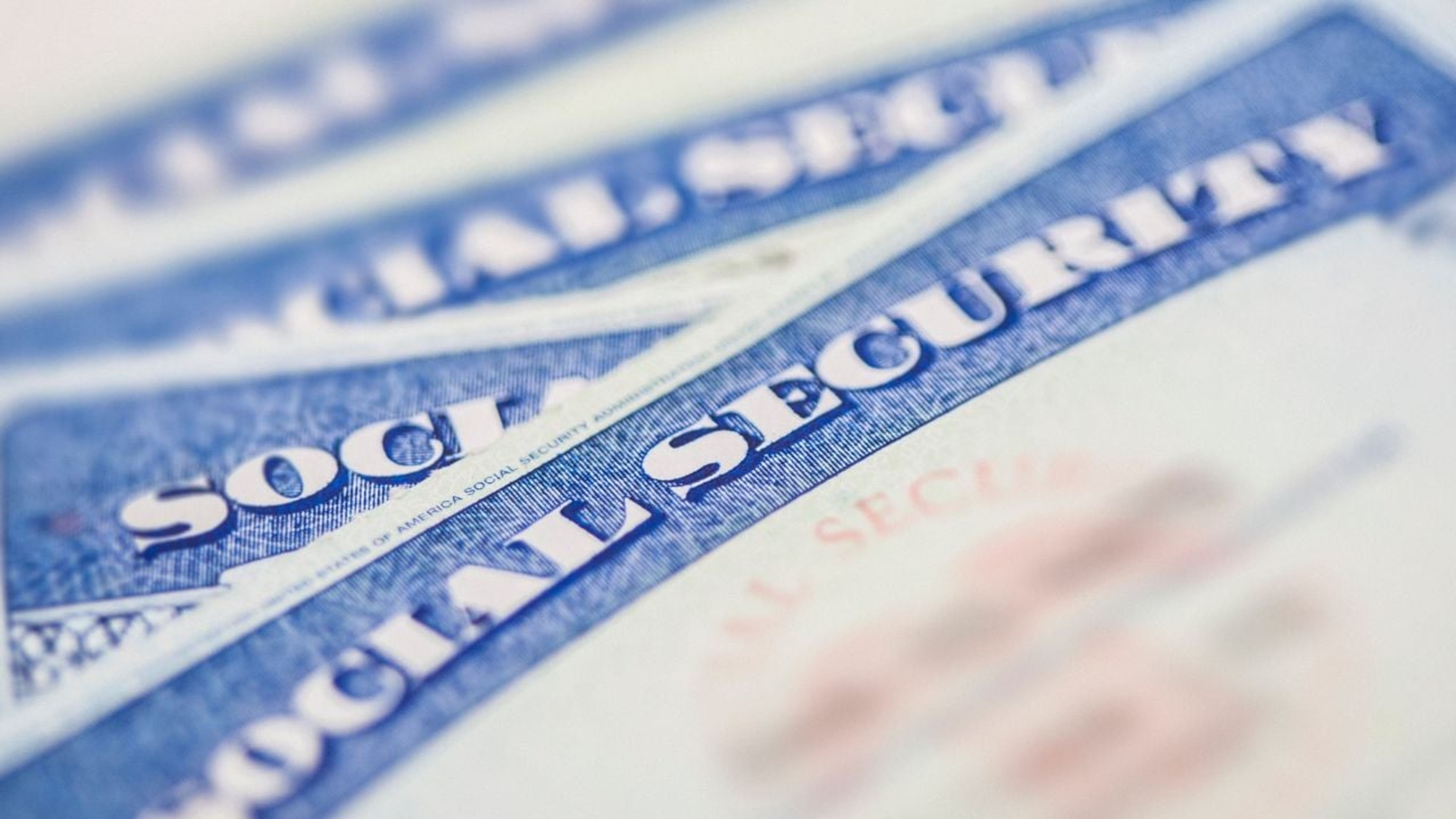 Social Security card and paperwork, as a benefits freeze leaves legal immigrants in limbo