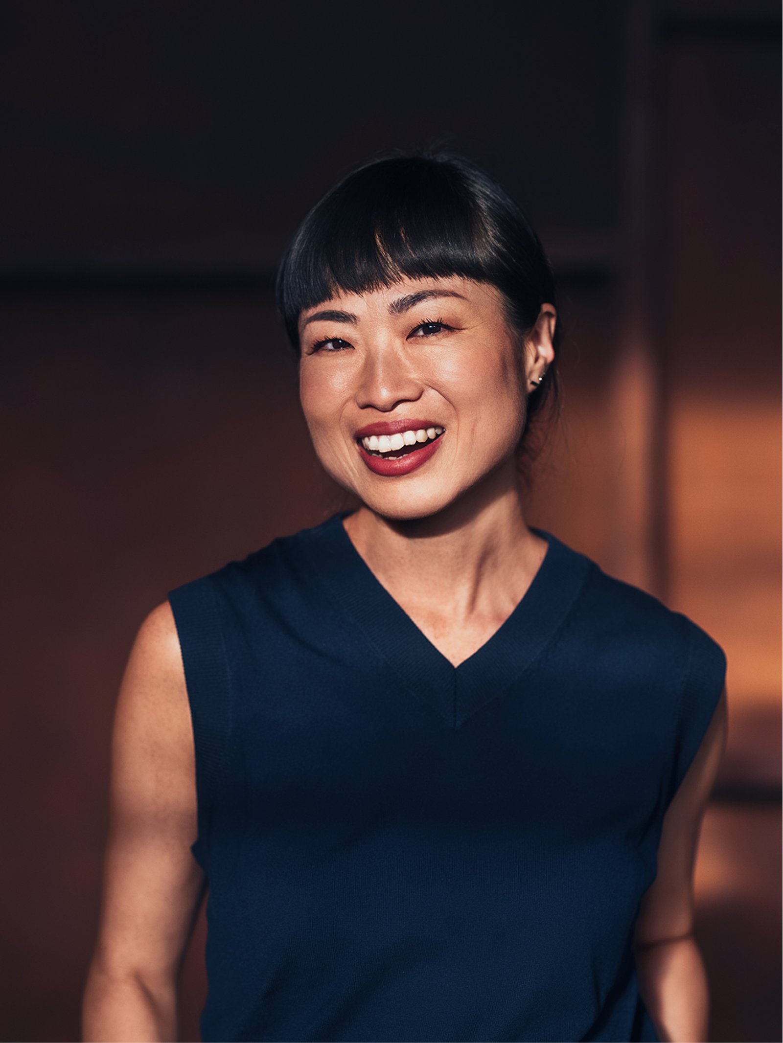 A founder smiling in a professional portrait