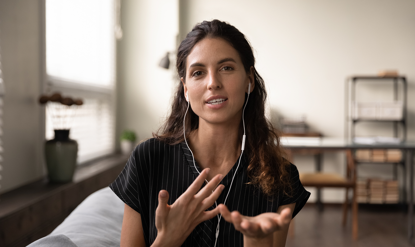 Person on a video call receiving immigration support.