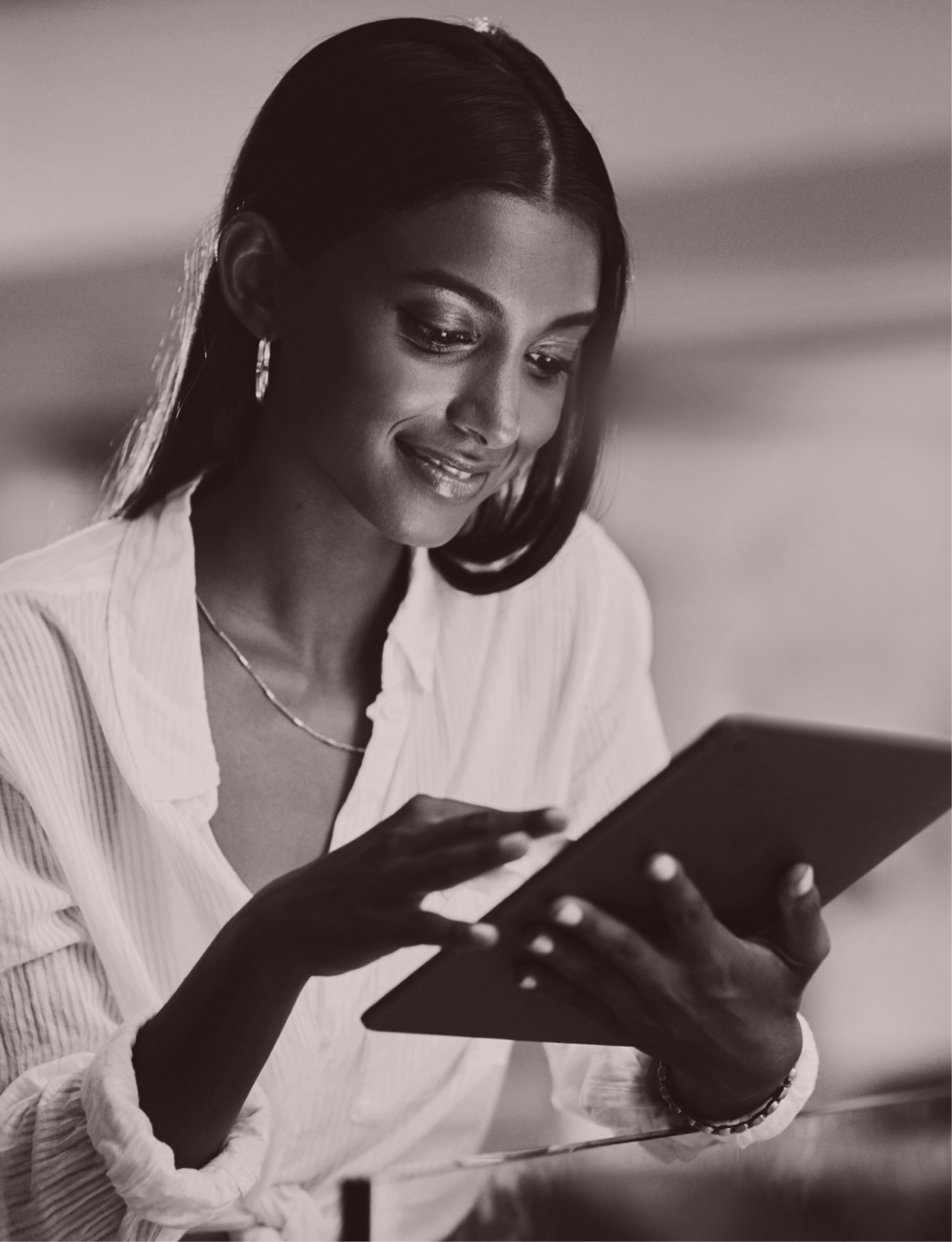 Person reviewing immigration information on a tablet.