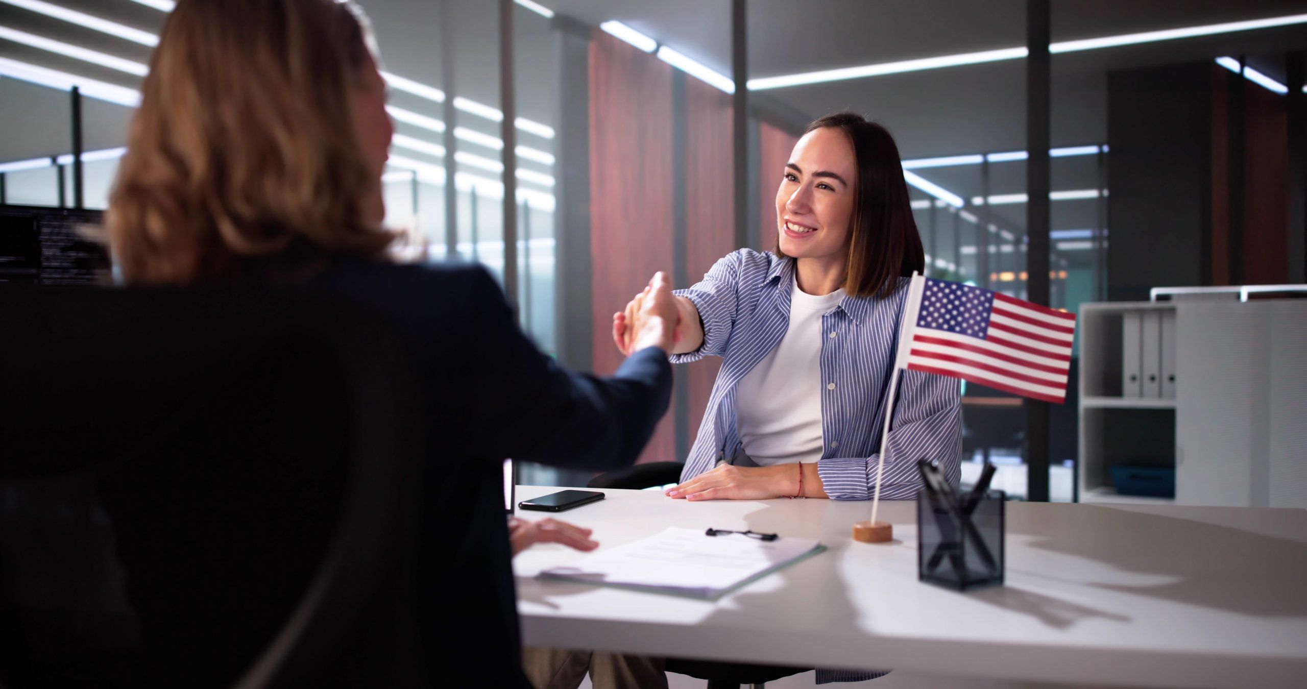 Applicant answering questions at a USCIS green card interview