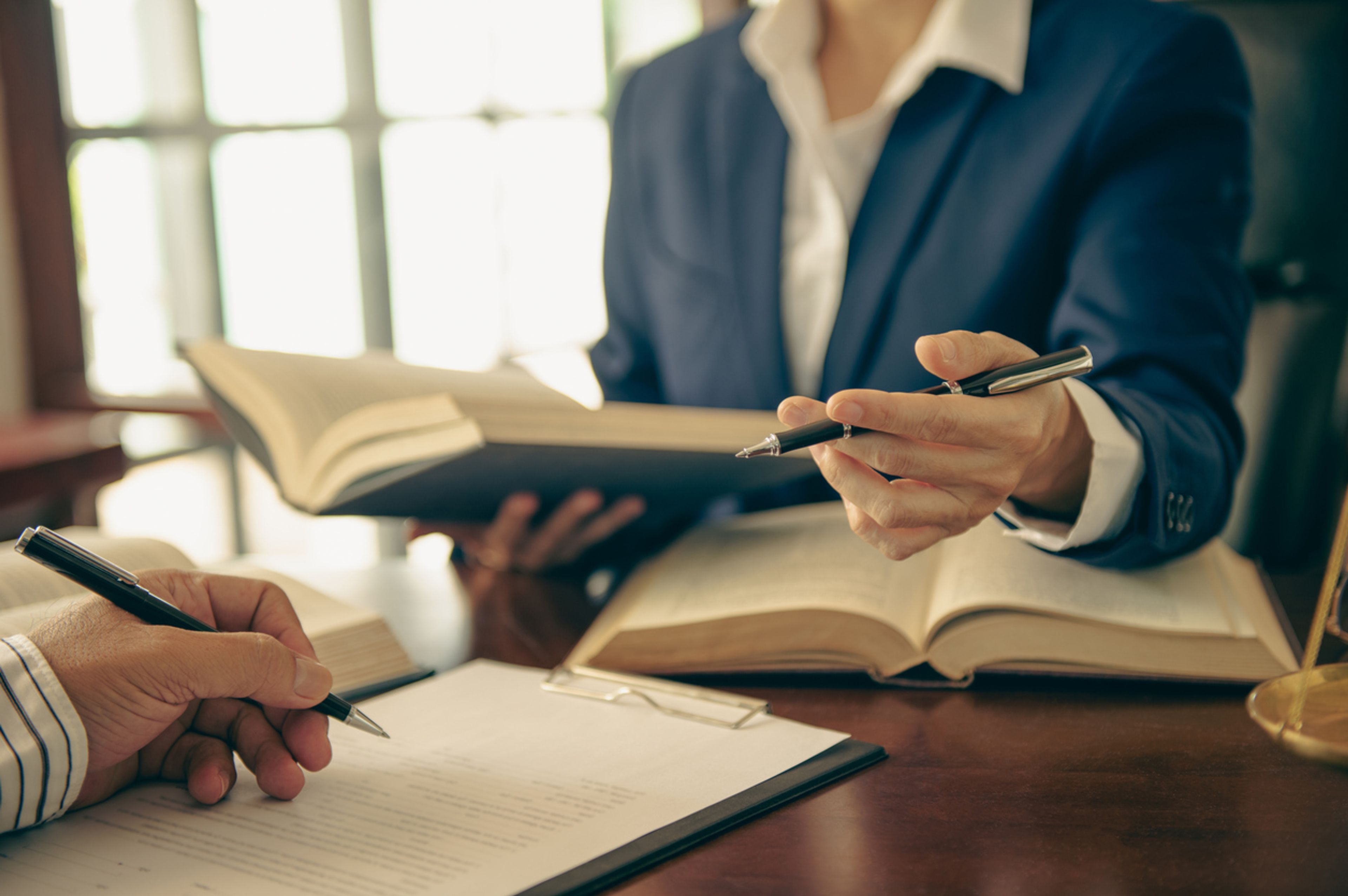 Client meeting with an immigration law firm attorney to set communication expectations