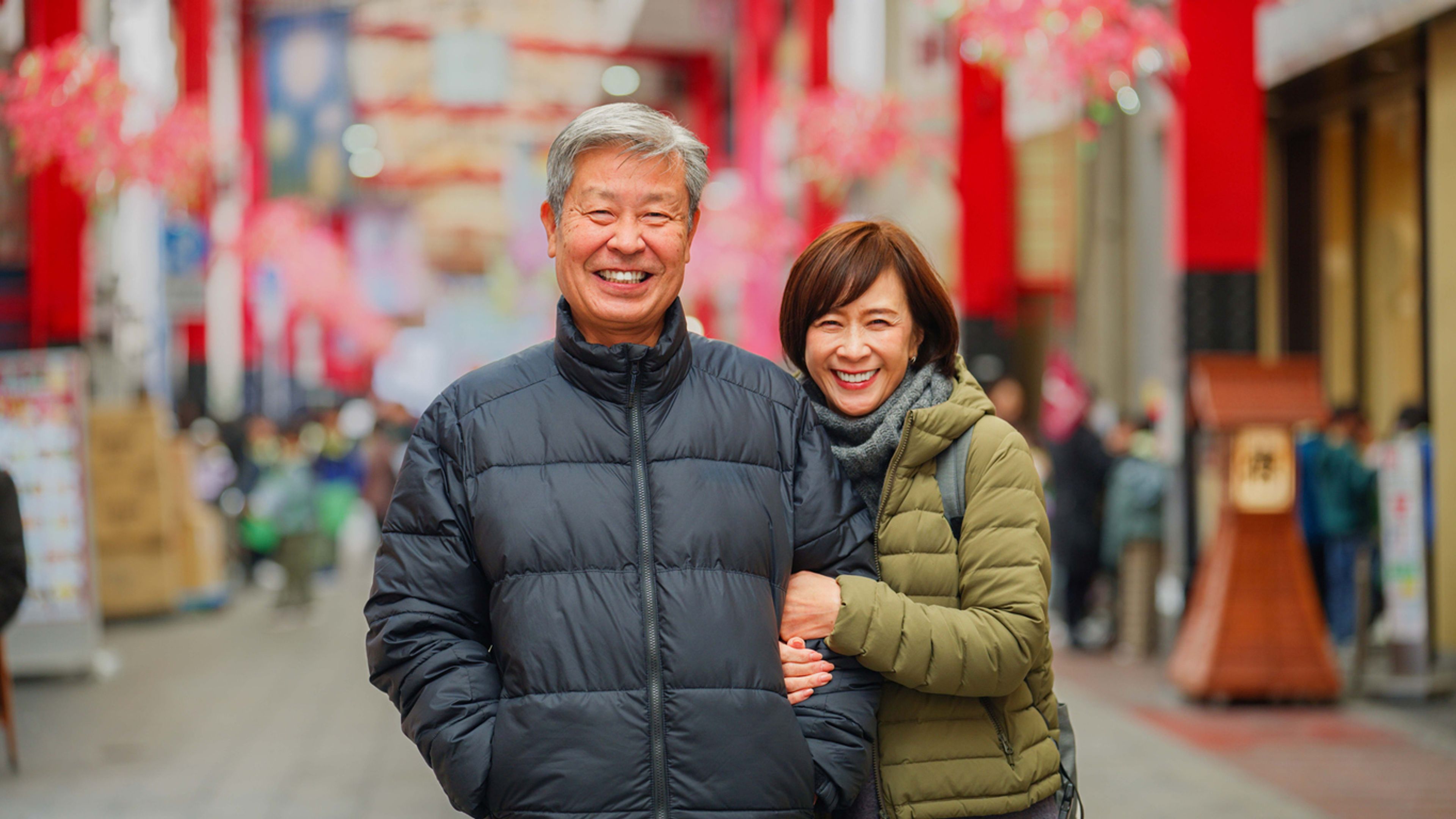 Married couple posing together in Tokyo, Japan.
