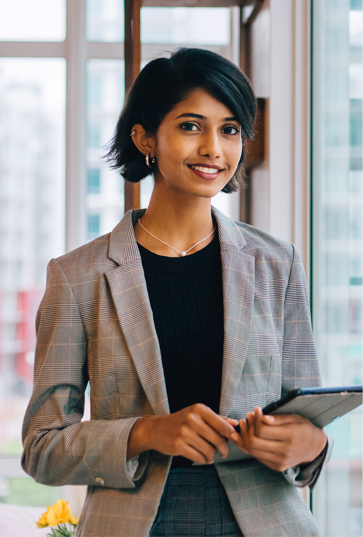 Manifest immigration client holding a tablet.