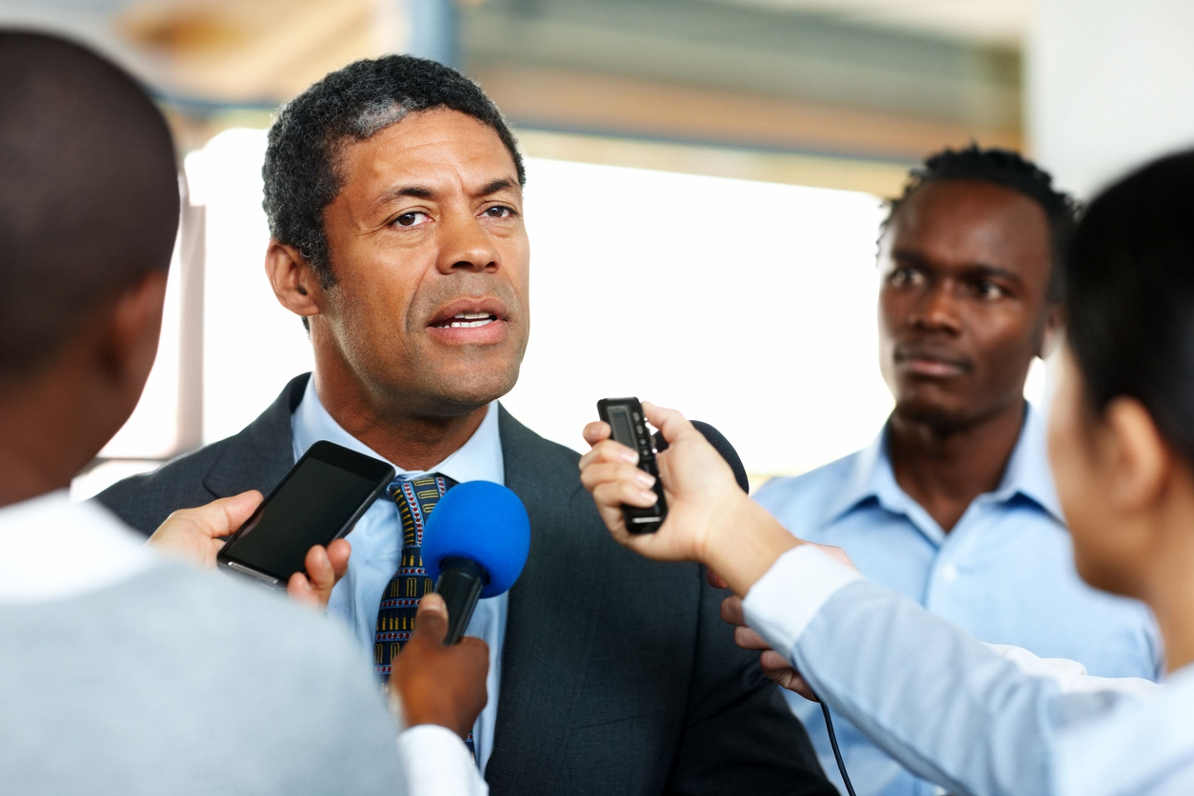 Business executive giving an interview to the press.
