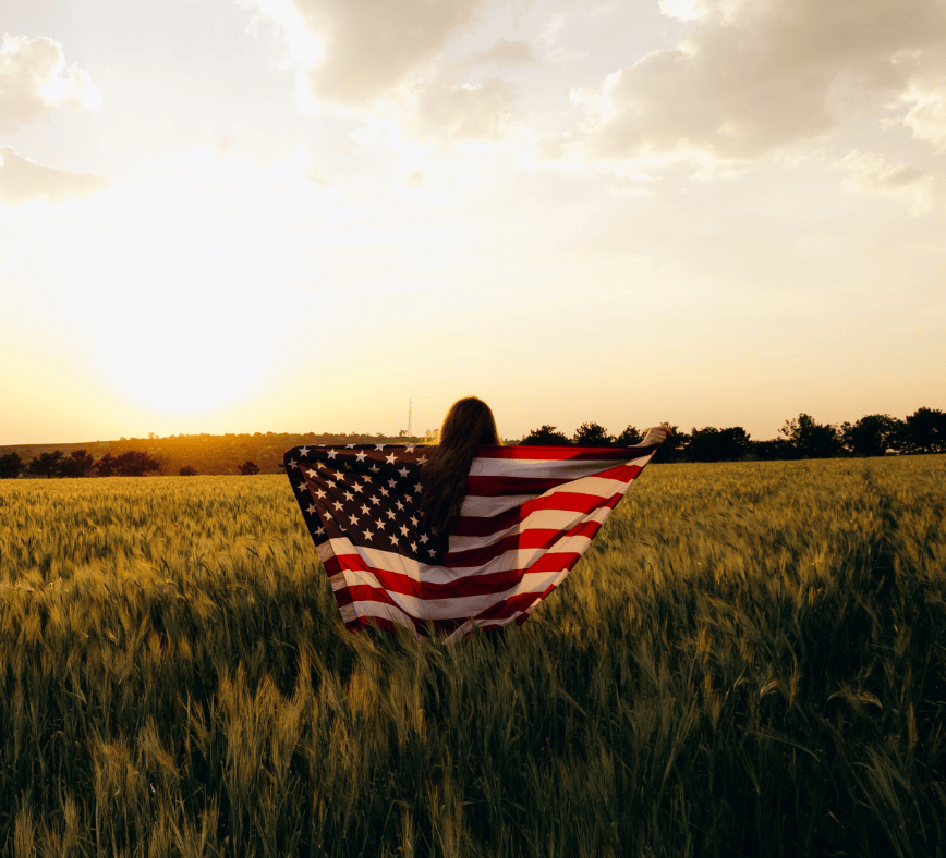 Immigration attorney answering common EB-1A green card questions with a client