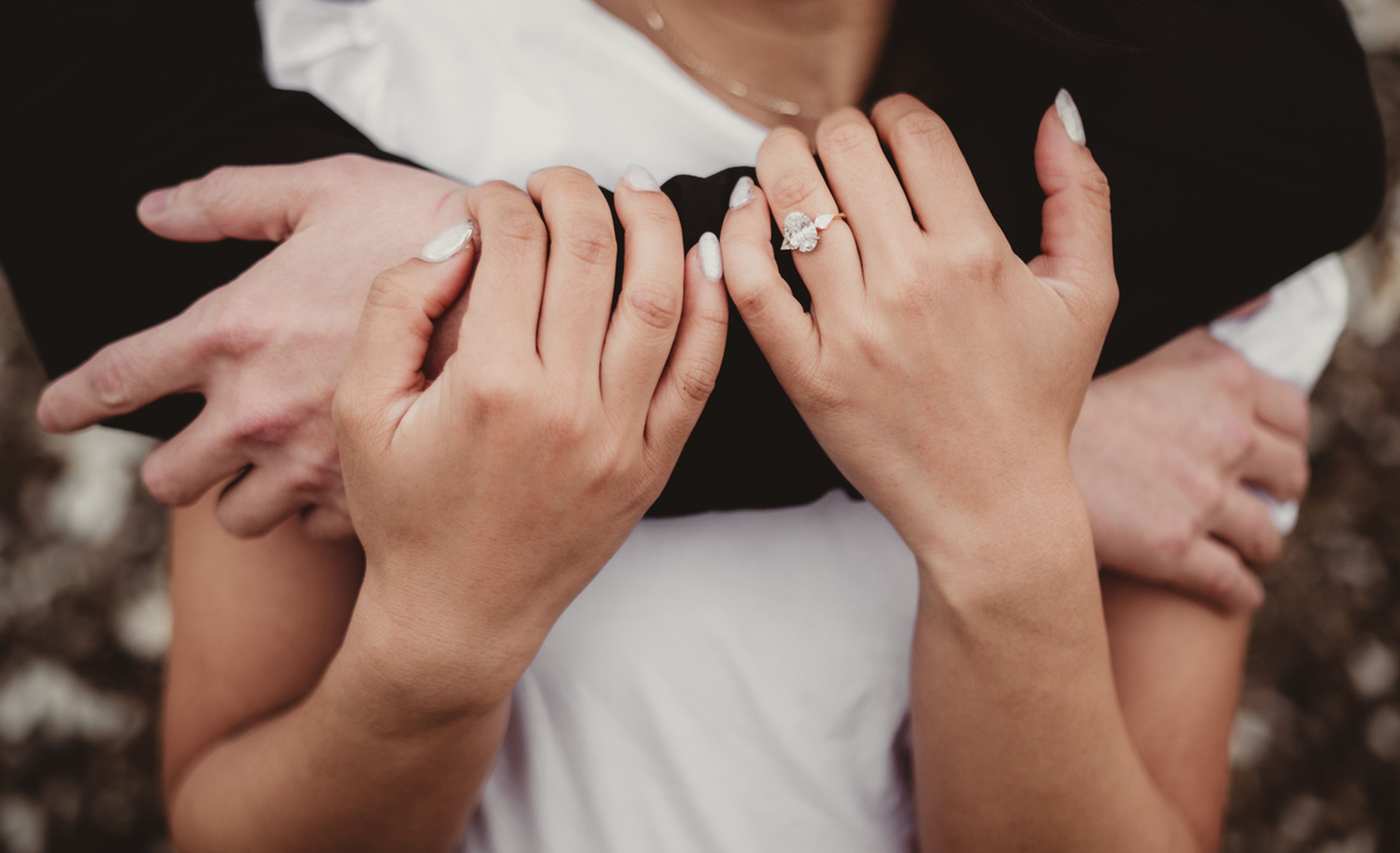 Engaged couple embracing close up