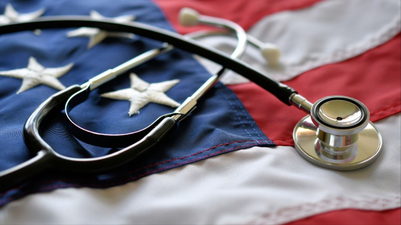 A stethoscope resting on a U.S. flag