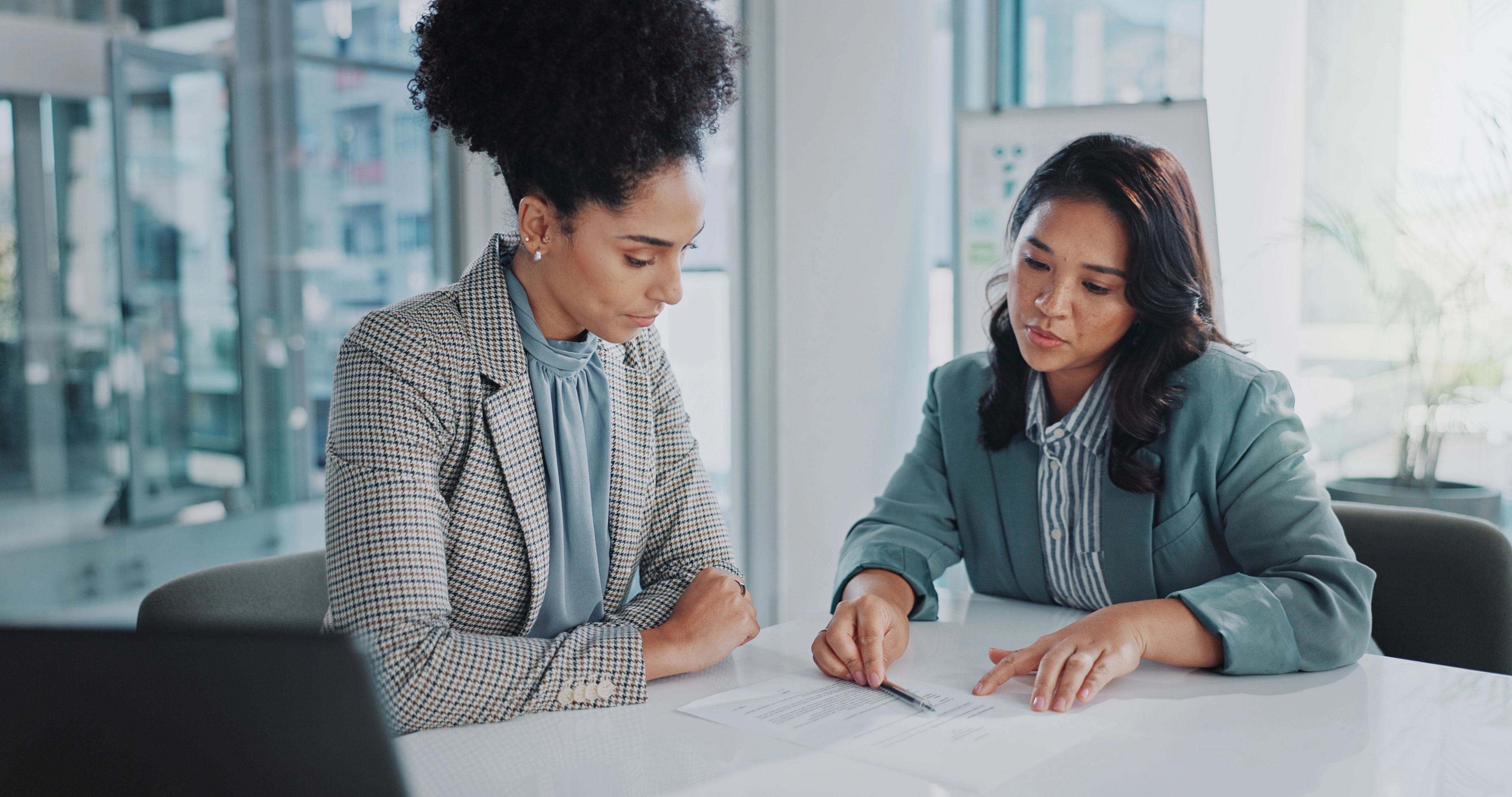 people meet and work on paperwork in office