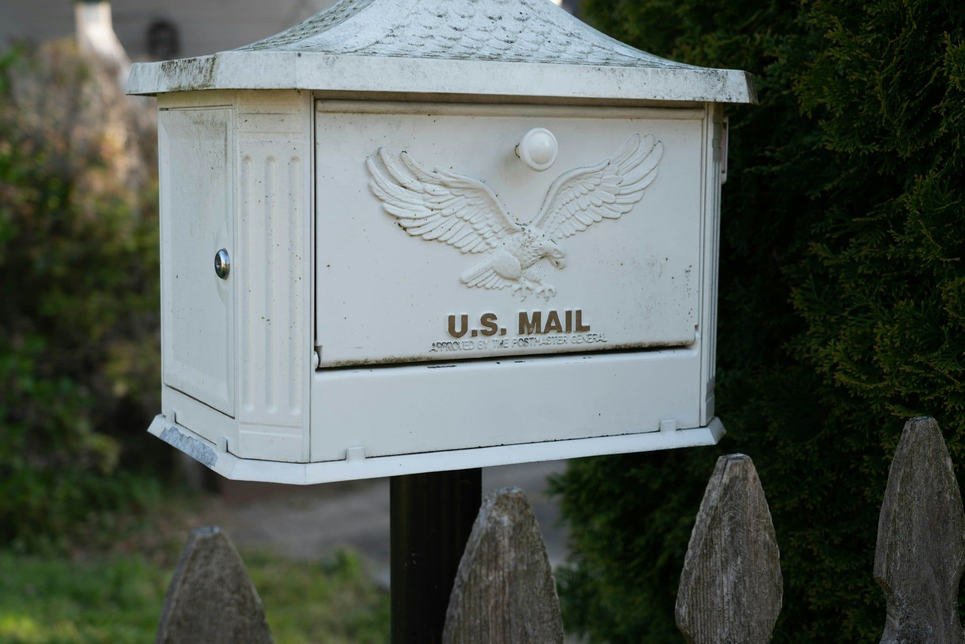 Person addressing an envelope to mail Form I-140 to a USCIS lockbox