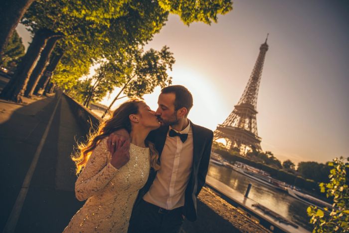 Married couple in Paris near the Eiffel Tower.