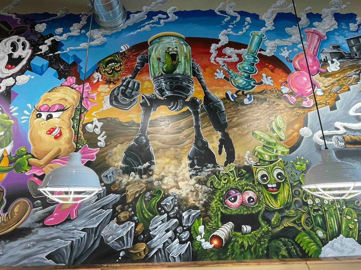 A mural of a robot pickle in a jar and other characters smoking weed