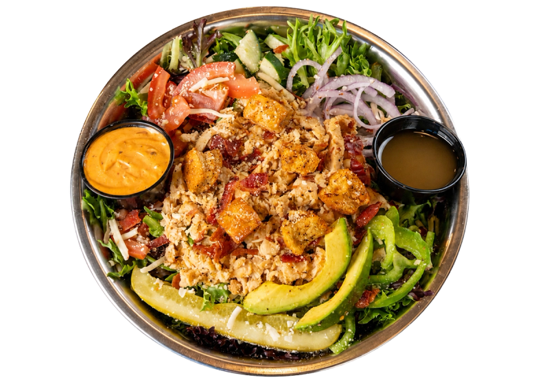 Kali Twist spicy CHICKEN club salad with grilled chicken breast, spring mix, tomatoes, green bell peppers, and onion.