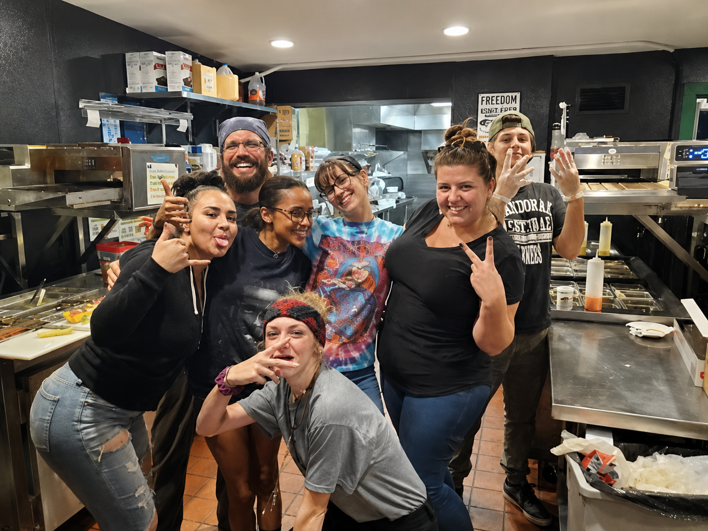 Cheba Hut team members posing together in the kitchen