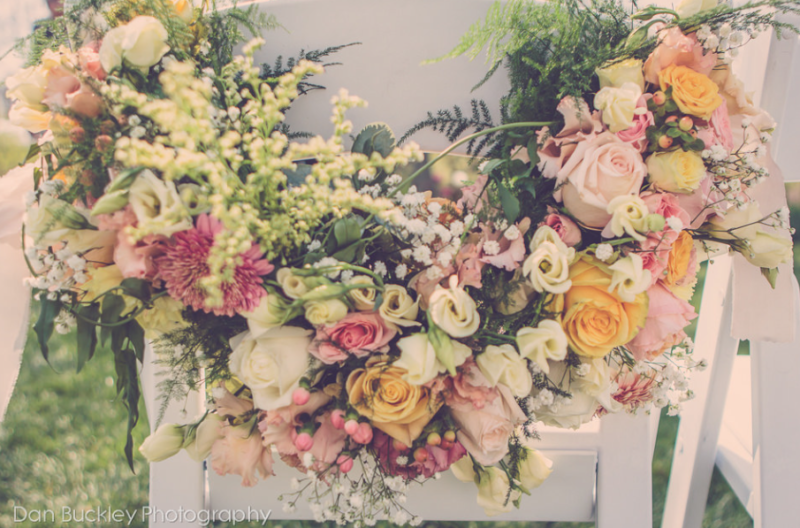 pink yellow and white flowers on a lush chair-bak