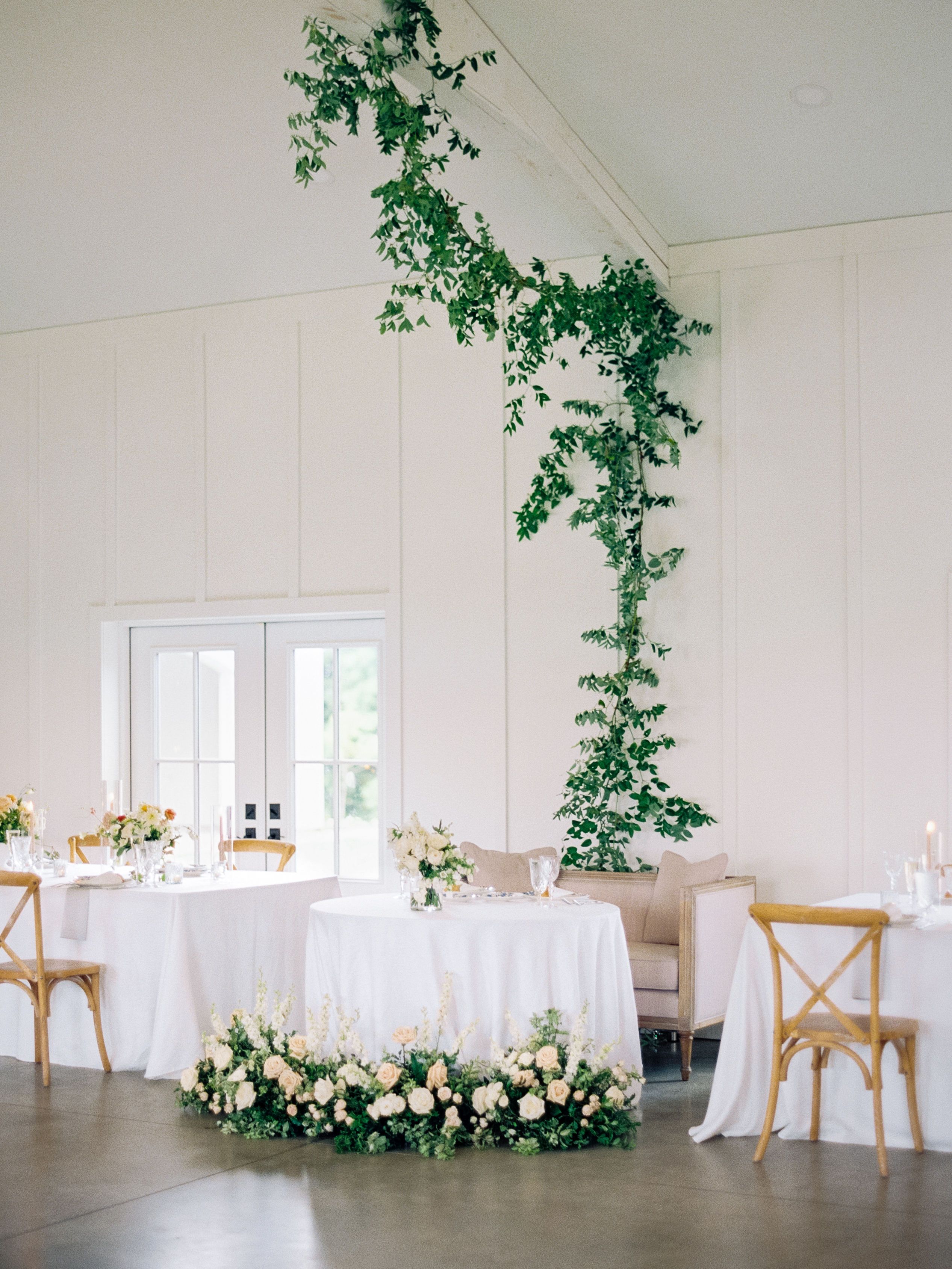 sweetheart table and greenery hung