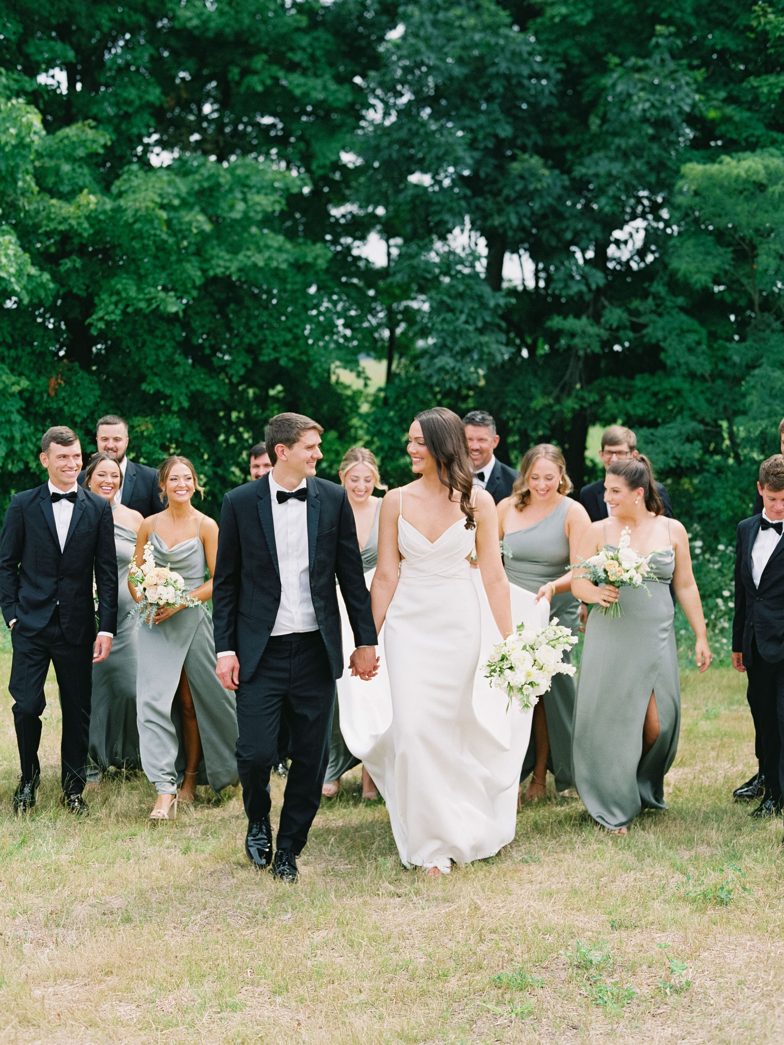 bridal party with flowers bouquets