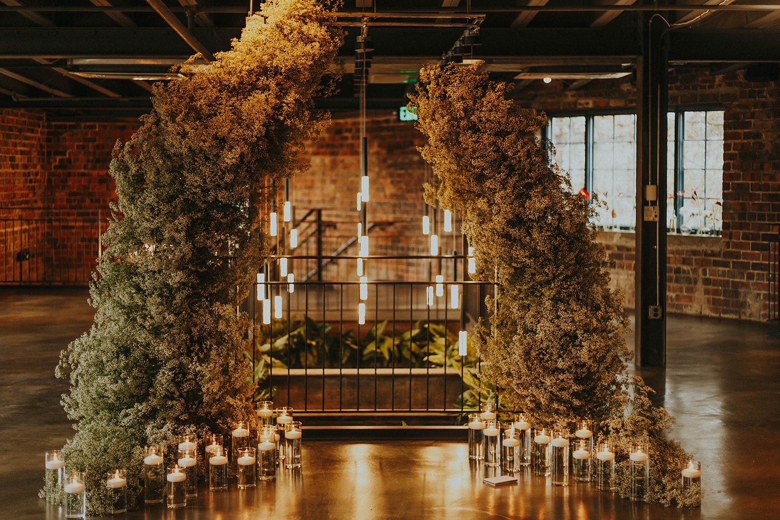 baby's breath arch and candlelight