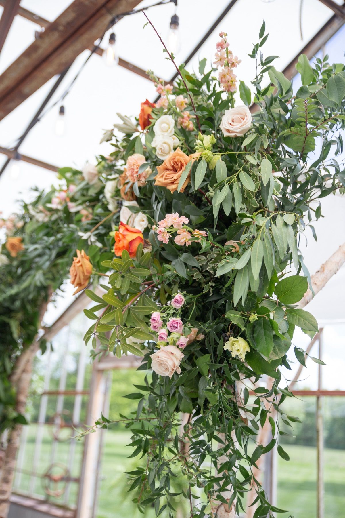 orange toned wedding arch florals columbus ohio