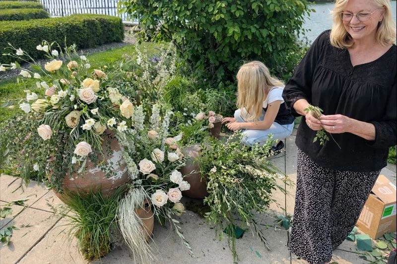 madison house designs setting up flowers at the club at corazon