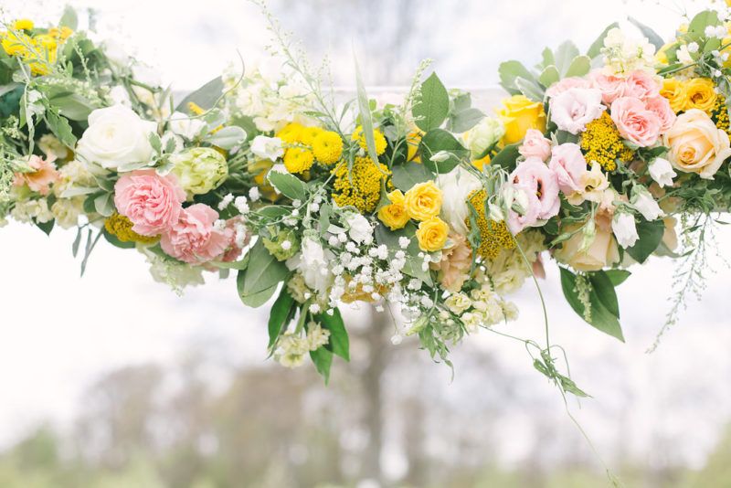 yellow spray roses, yarrow, mums and roses; pink spray roses, lisianthus, and carnations; white baby breath, campanula, stock, and astilbe